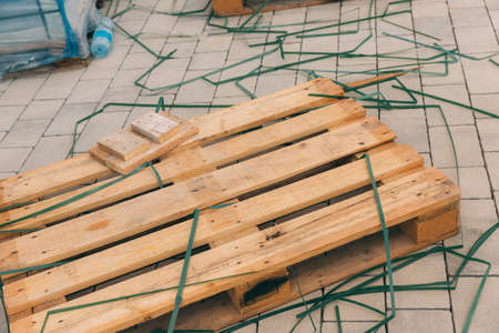 Wooden pallet among the construction debris. Item for transportation and preservation of building...