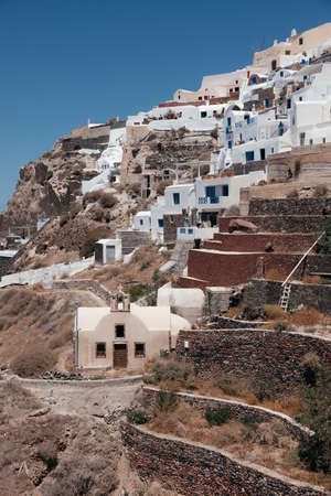 View of Oia town with church in Santorini island in Greece. Summer vacation and holiday concept, luxury travel. Wonderful scenery, cruise ships and white architecture. amazing sceneryの写真素材