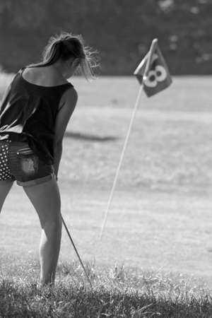 girl playing golfの写真素材
