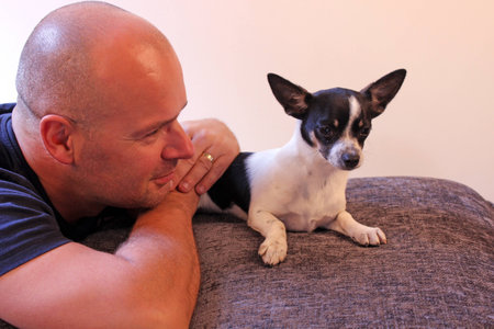 man and puppyの写真素材