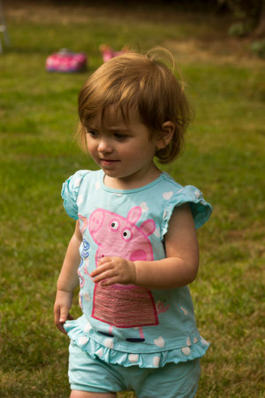 cutie child walking in the garden