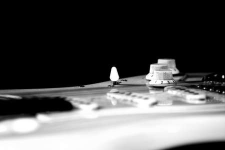 White electric guitar on black backgroundの写真素材