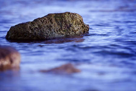 Blue water and the stoneの写真素材