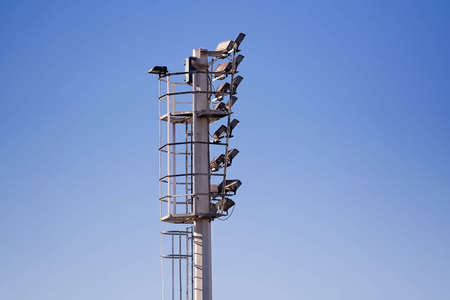 Stadium lights and clear blue skyの写真素材