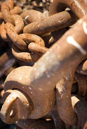 Rusty metal chains at the dock