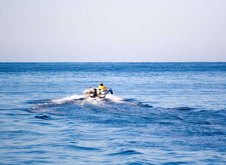Man in the motor boat speeding