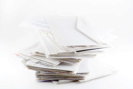 Stack of envelopes ( bills)  on white backgroundの写真素材