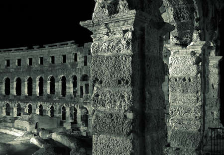 Night photo of the ancient Roman amphitheater in Pula , Croatiaの写真素材