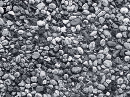 Wall made of small river stones , BW photo , nice texture for your projectsの写真素材