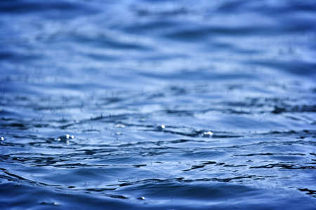 Beautiful blue water surface close up photoの写真素材