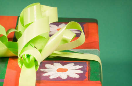 Close up of a gift box on green background , shallow DOF photoの写真素材