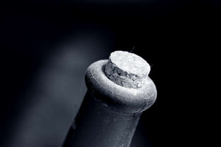 Old dusty wine bottle , black and white photo with shallow DOFの写真素材