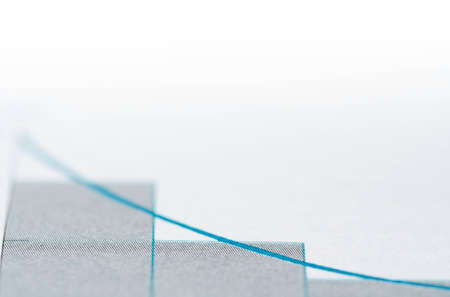 Graph showing loss of profits , close up photo with shallow dof and space for your textの写真素材