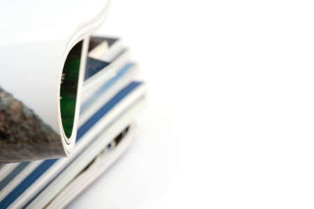 Stack of magazines studio isolated on white background with space for your textの写真素材