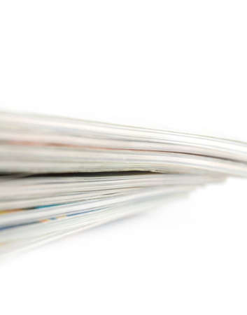 Stack of magazines studio isolated on white background with space for your textの写真素材