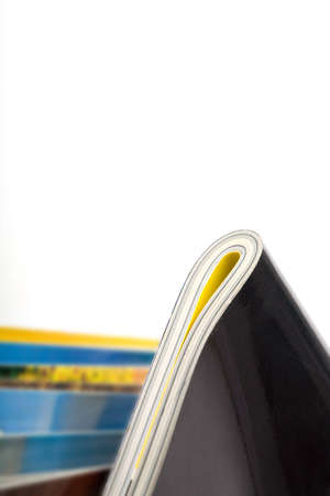 Stack of magazines studio isolated on white background with space for your textの写真素材