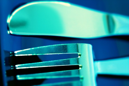 Knife and fork on a dark plate