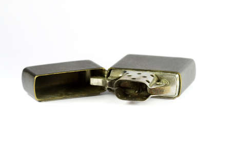 Old metal lighter studio isolated on white