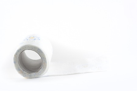 Close-up  of toilet paper studio isolated on white backgroundの写真素材
