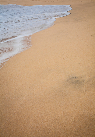Beautiful surfing tropical sand beach background detail on sunny summer dayの写真素材