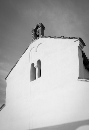 Small Mediterranean Catholic church in Croatia, black and white toned photoの写真素材