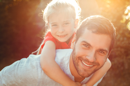 Father and daughter walk outdoors family timeの写真素材