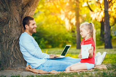Father and daughter walk outdoors family timeの写真素材