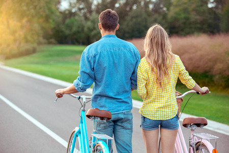 Couple riding bicycle together active lifestyle conceptの写真素材