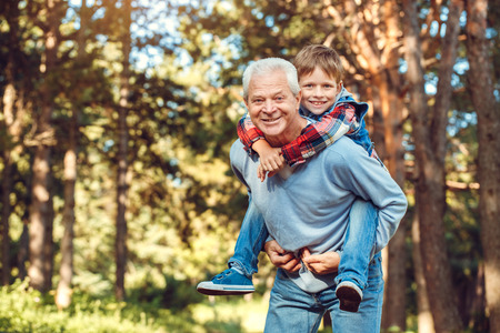 Grandfather and grandson together outdoors family conceptの写真素材