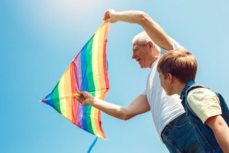 Grandfather and grandson together outdoors family conceptの写真素材