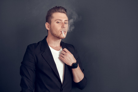 Young blonde business man isolated studio conceptの写真素材