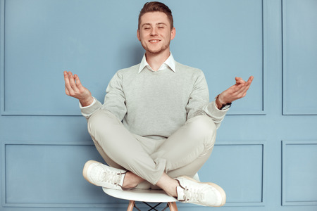 Young man freestyle modern casual look studio conceptの写真素材