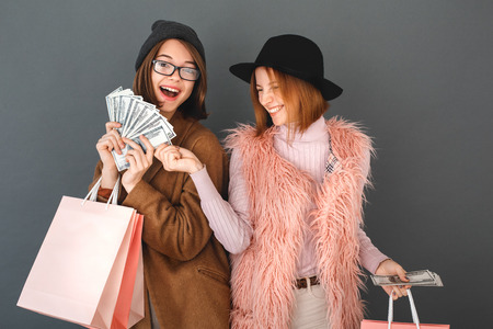 Young girls teenagers friends together shopping conceptの写真素材