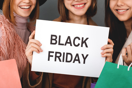 Young girls teenagers friends together shopping conceptの写真素材