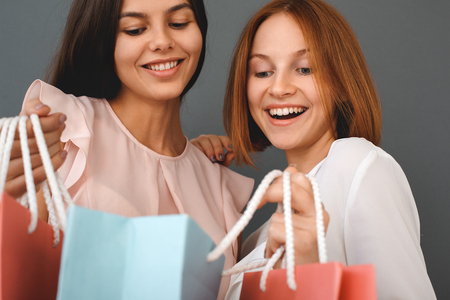 Young girls teenagers friends together shopping conceptの写真素材