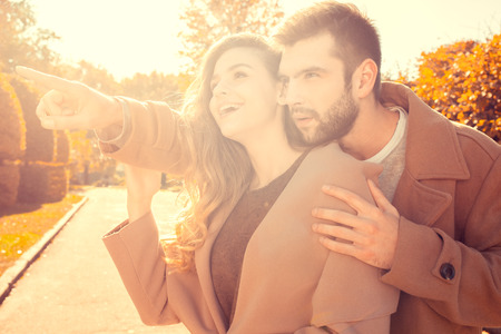 Young couple walk in the autumn parkの写真素材