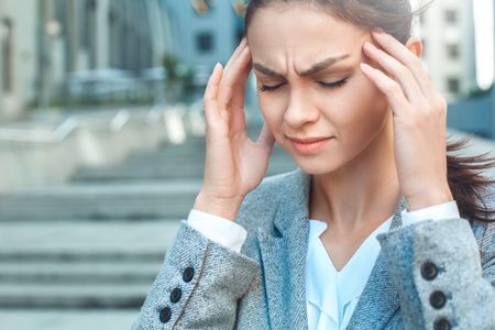 Stylish business woman outdoors city walkの写真素材