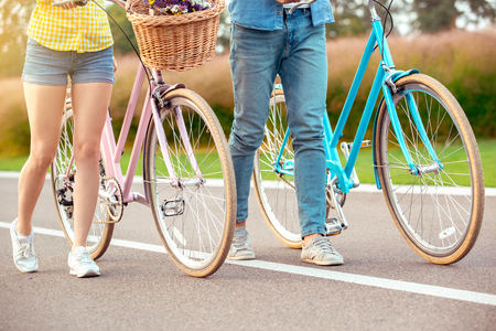 Couple riding bicycle together active lifestyle conceptの写真素材