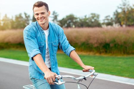 Young man riding a bicycle healthy lifestyle conceptの写真素材