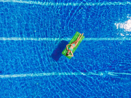 Young person in the swimming pool leisure conceptの写真素材