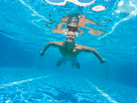 Young person in the swimming pool leisure conceptの写真素材