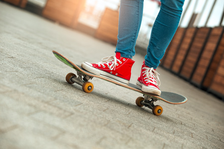 Young woman with skateboard outdoors active lifestyleの写真素材
