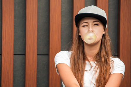 Young woman with skateboard outdoors active lifestyle