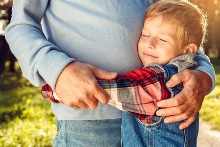 Grandfather and grandson together outdoors family concept