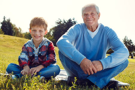 Grandfather and grandson together outdoors family conceptの写真素材