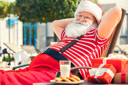 Santa Claus near the pool holiday vacation conceptの写真素材