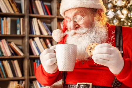 Santa Claus in the library christmas new year conceptの写真素材