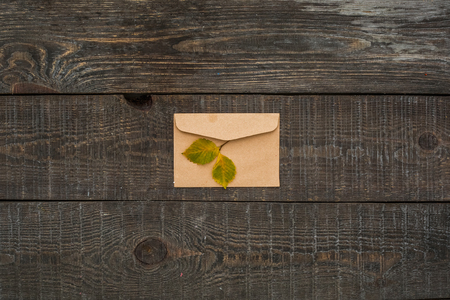 Envelope on wooden table isolated no peopleの写真素材