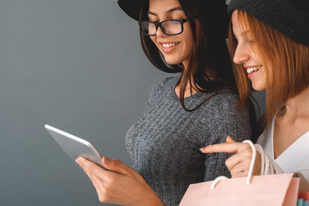 Young girls teenagers friends together shopping concept
