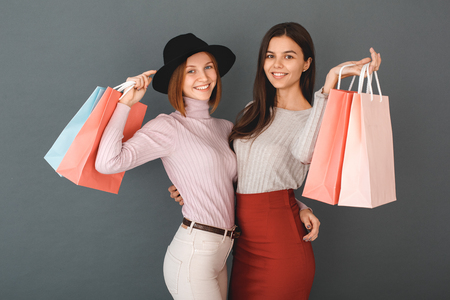 Young girls teenagers friends together shopping conceptの写真素材